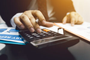 Business Man Accountant Using Calculator To Calculating Bugget - Rocha Contábil